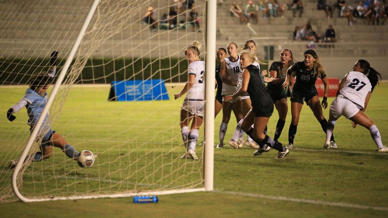 Hawaii freshman Nalani Damacion (34) and teammates watched as her shot crossed the goal line for the game-winning score against Georgia Southern and goalkeeper Quinn Wilson in the 2024 season opener at Waipio Peninsula Soccer Stadium on Thursday night.