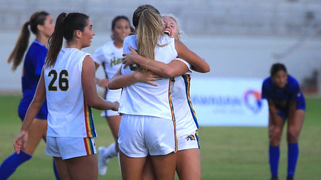 Hawaii midfielder Nalani Damacion, back to camera, got a hug from Mia Foster after the two connected for the go-ahead goal against UC Riverside at Waipio Peninsula Soccer Complex on Sunday night. Cate Sheahan (26) scored the game-tying goal earlier in the half.