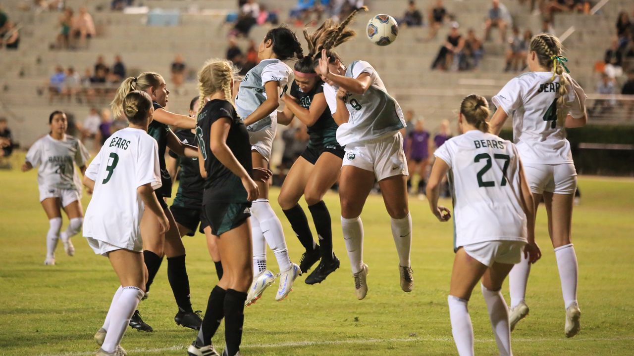 Hawaii freshman Laule‘a Ah Mook Sang went for a header between two Baylor players to receive a corner kick in the second half of Wednesday's 1-0 loss to the Bears.