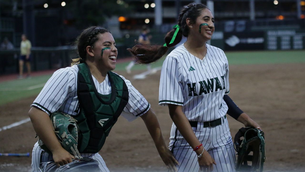 Hawaii catcher Izzy Martinez and pitcher Brianna Lopez smiled after getting out of the fourth inning against UC Davis unscathed on Thursday.