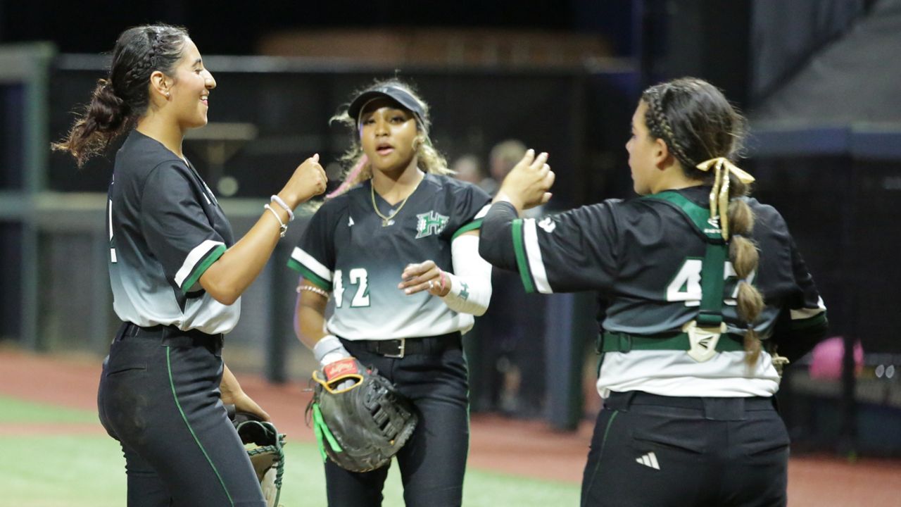 Hawaii ace Brianna Lopez, left, celebrated with first baseman Mya'Liah Bethea, middle, and catcher Izzy Martinez, right, in Saturday's nightcap against UC Riverside. Martinez hit three home runs and drove in six runs on the day. 