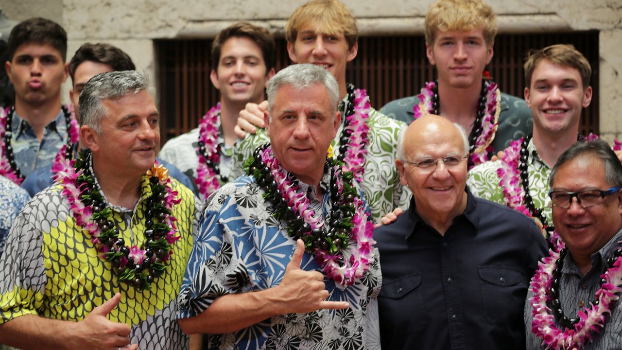 Hawaii men's volleyball coach Charlie Wade, middle, and UH players and coaches posed with Honolulu Mayor Rick Blangiardi, in black.