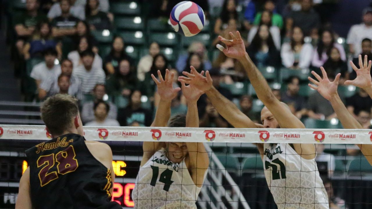 Loyola Chicago's Daniel Fabikovic took a swing into the block of Hawaii's Alaka‘i Todd and Guilherme Voss on Friday night.