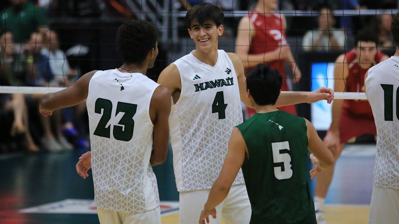 Hawaii freshman opposite Kainoa Wade, middle, made his collegiate volleyball debut against Harvard at the Stan Sheriff Center on Wednesday night.