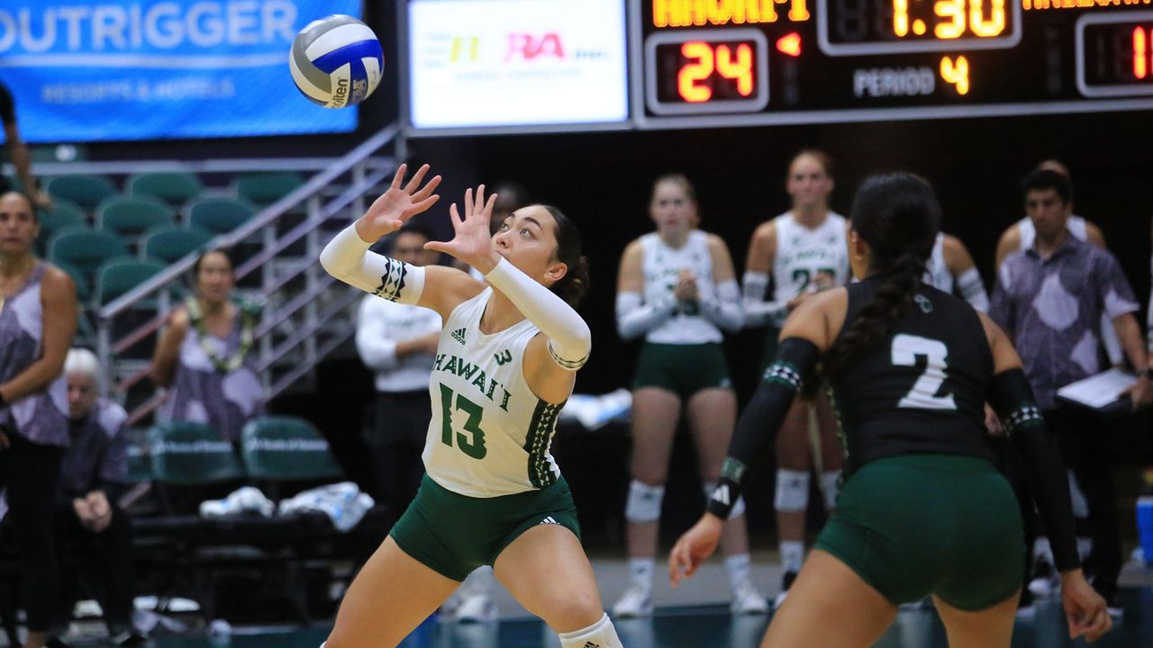 Hawaii freshman hitter Cha'lei Reid (13), a Kahuku High graduate, received a serve against Arizona State in a spring exhibition match at the Stan Sheriff Center on Tuesday night.