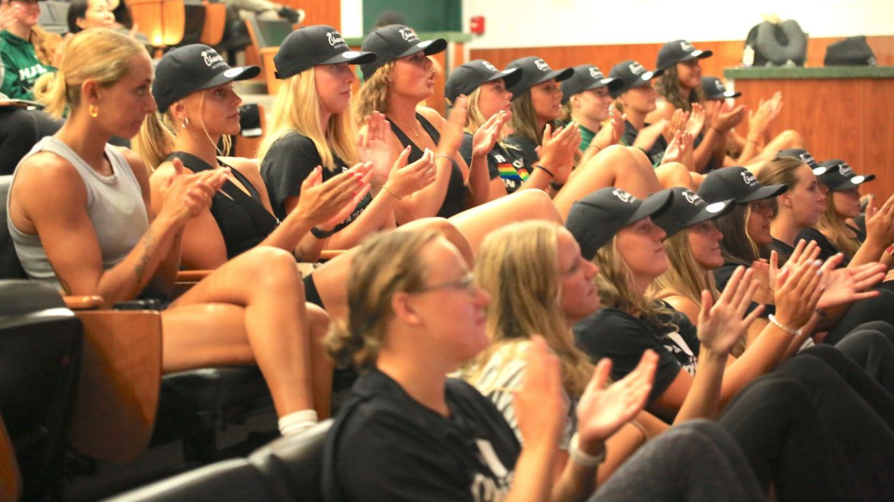 The Hawaii water polo team clapped during the NCAA Tournament selection show in the UH Lower Campus athletics lecture hall on Monday.