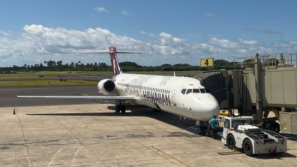 A Hawaiian Airlines plane waits at the gate. (Spectrum News/Ryan Cooper)