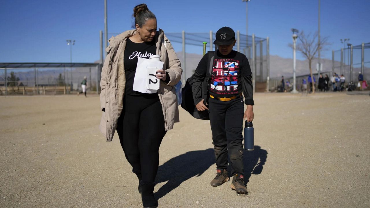 Doreen Hall Vann and son Zaiden, who moved from Hawaii to Las Vegas in 2019, are among the majority of Native Hawaiians who now live on the continent. (Associated Press/John Locher, file)