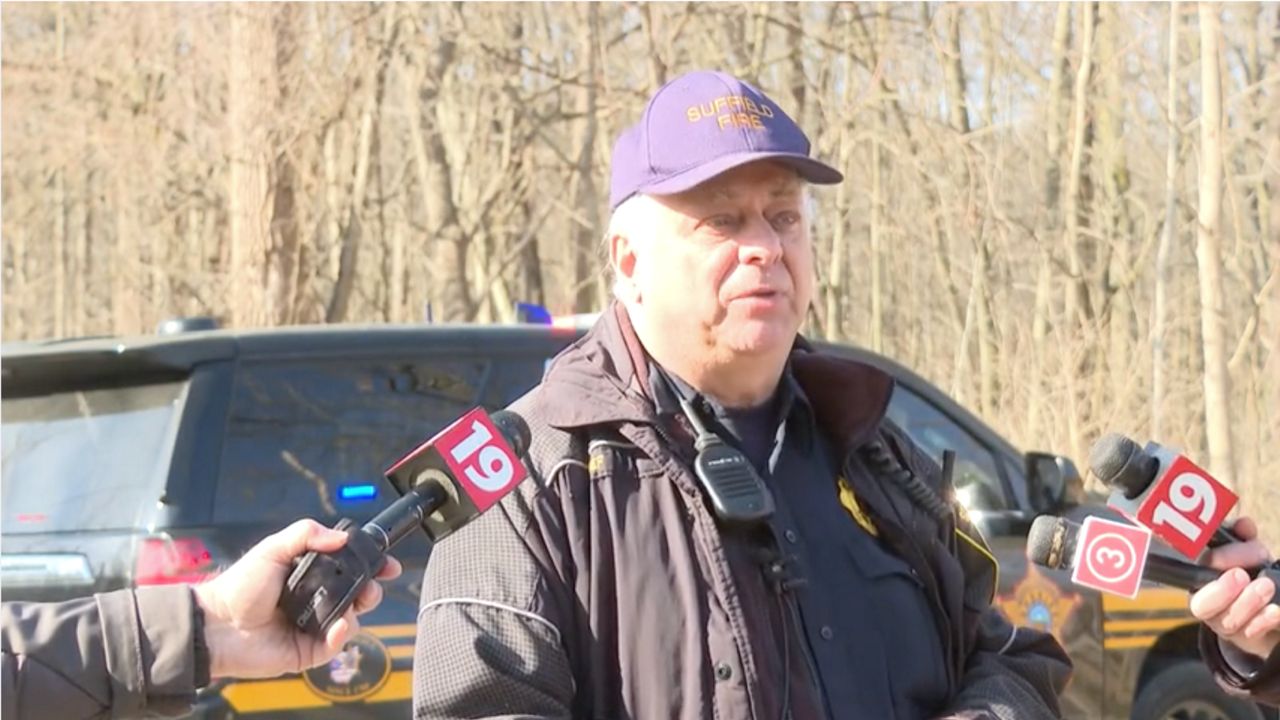 Suffield Township Fire Chief Bob Rasnick speaks to reporters Friday morning.