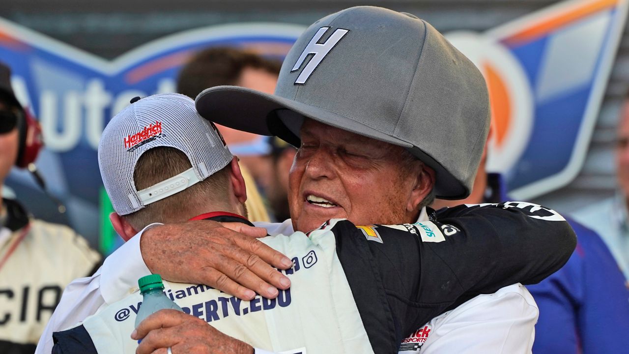 Team owner Rick Hendrick, right, hugs driver William Byron after he won the NASCAR Cup Series auto race at Texas Motor Speedway in Fort Worth, Texas, Sunday, Sept. 25, 2022. (AP Photo/Larry Papke)