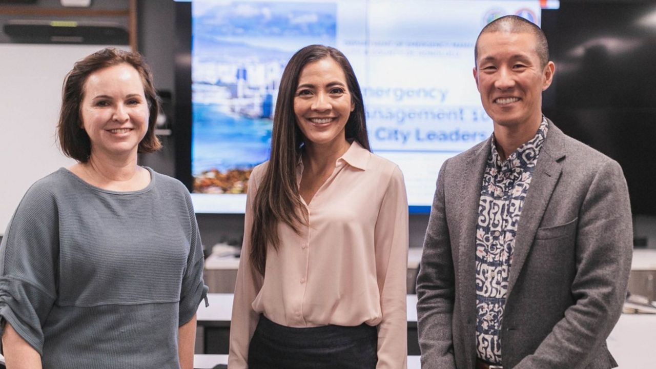 Department of Emergency Management director Hiro Toiya (right) and deputy director Jennifer Walter, who will replace him on an interim basis, met with Honolulu City Council member Val Okimoto in 2023. (Facebook)