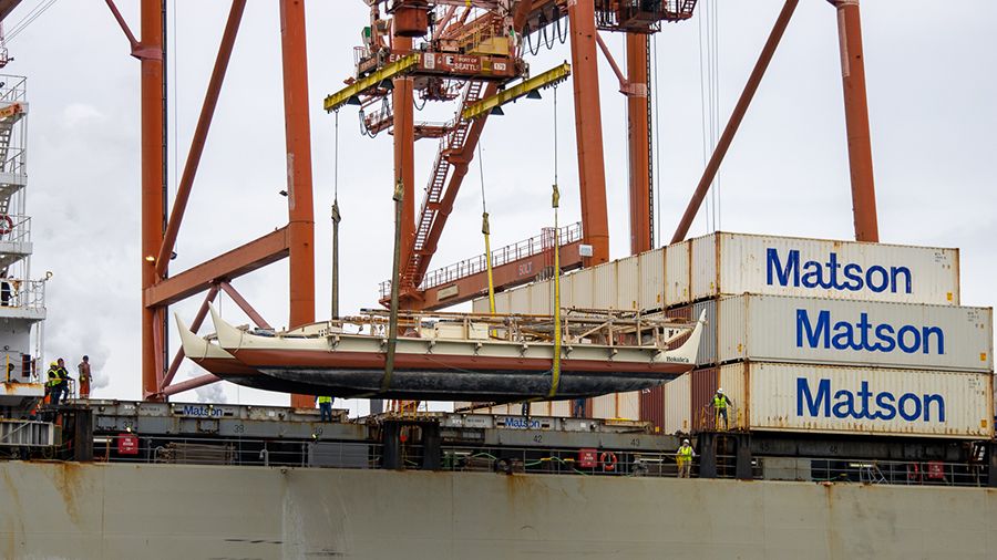 Hokulea being lifted off the Matson carrier ready to reunite with the Pacific Ocean. (Photo courtesy of the Polynesian Voyaging Society)