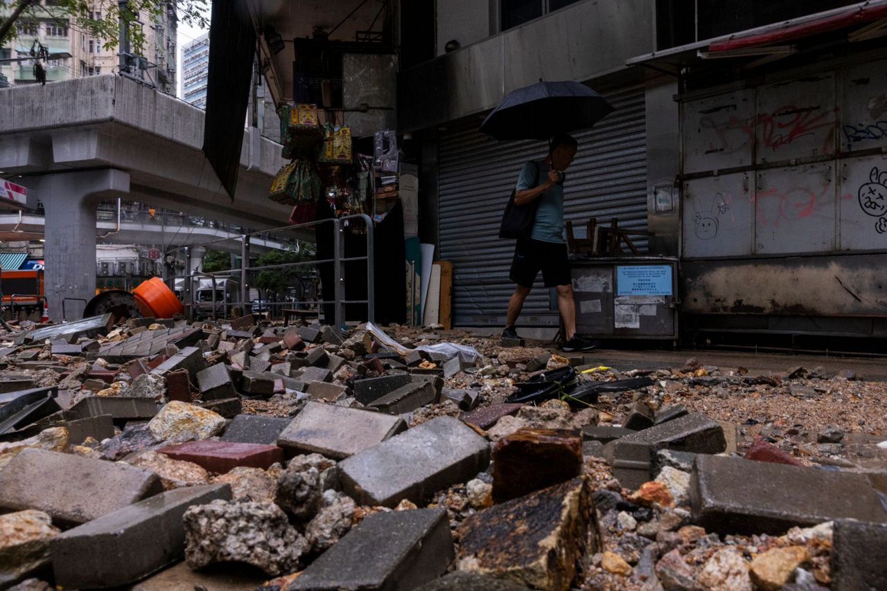 Rain pouring onto Hong Kong and southern China floods city streets and ...