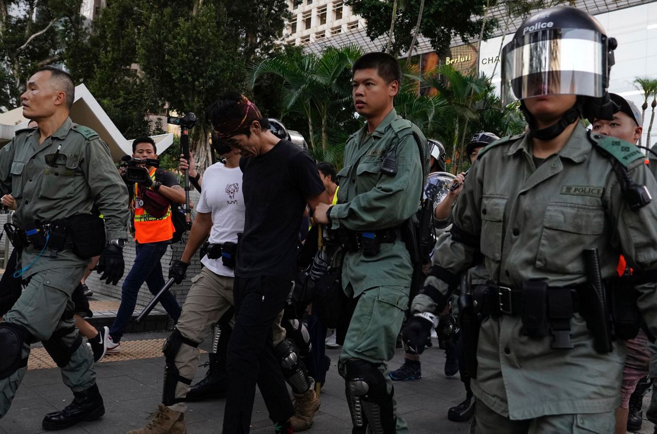 Hong Kong suspends trains, appeals to public after rioting