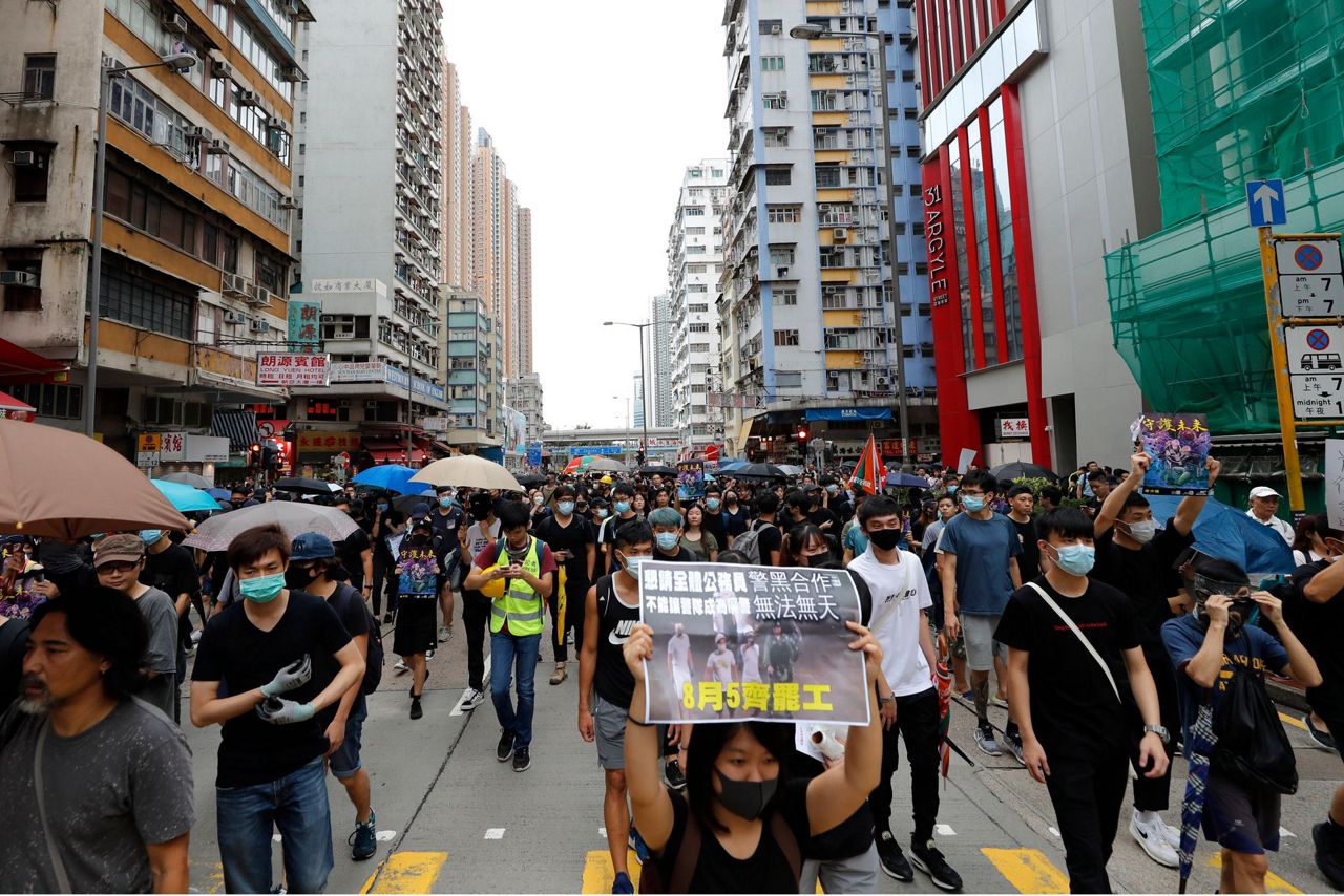 Hong Kong police say protests off designated route illegal