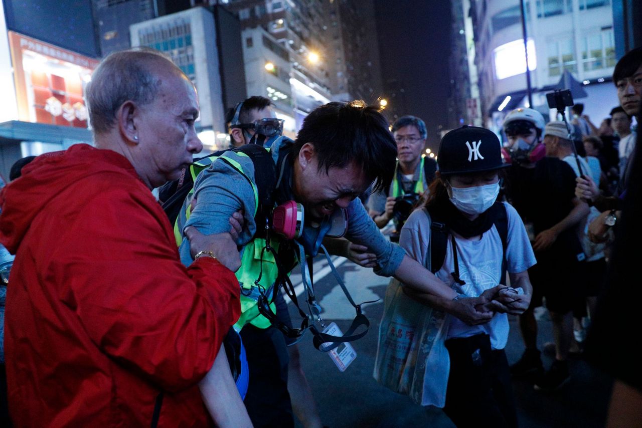 Hong Kong rally targets police conduct, use of dogs