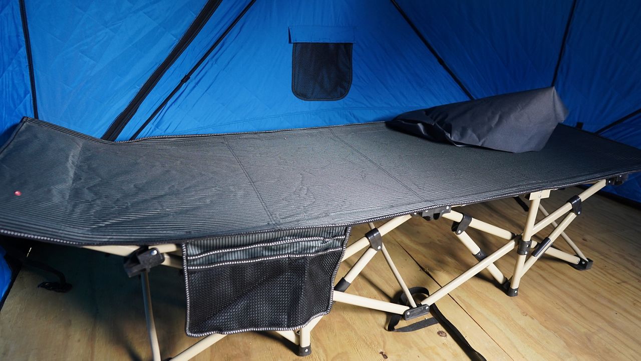 A cot inside a tent at Hope Village (Spectrum News 1/Jonathon Gregg)