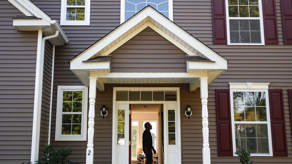 A homeowner tours his new home, Tuesday, July 21, 2020, in Washingtonville, N.Y. (File, AP Photo/John Minchillo)