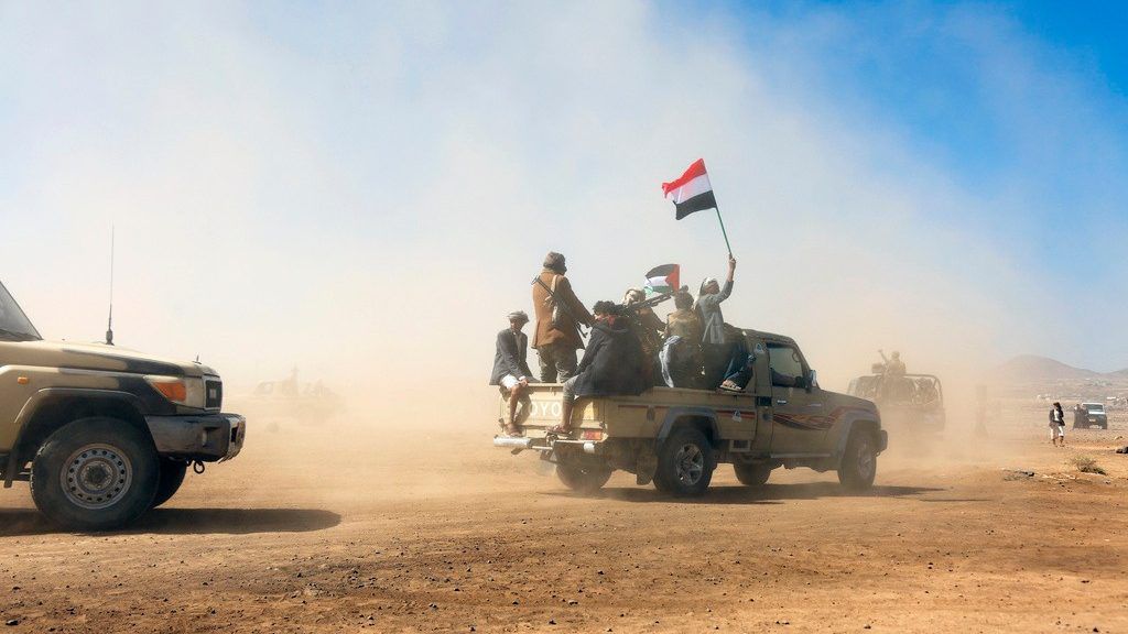 Houthi fighters and tribesmen stage a rally against the U.S. and the U.K. strikes on Houthi-run military sites near Sanaa, Yemen, on Sunday, Jan. 14, 2024. (AP Photo)