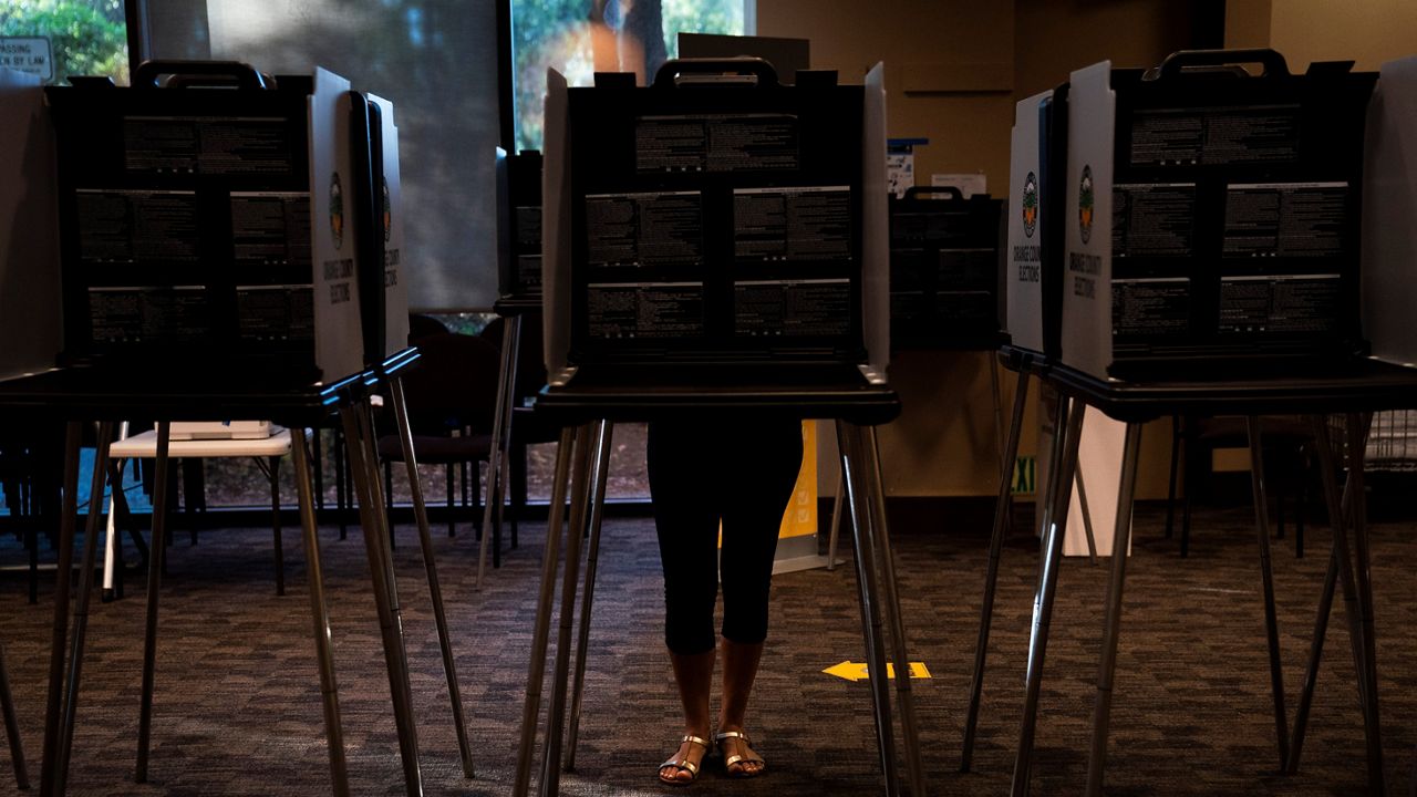 A voter casts her ballet at a vote center, Tuesday, Sept. 14, 2021, in Huntington Beach, Calif. (AP Photo/Jae C. Hong, File)