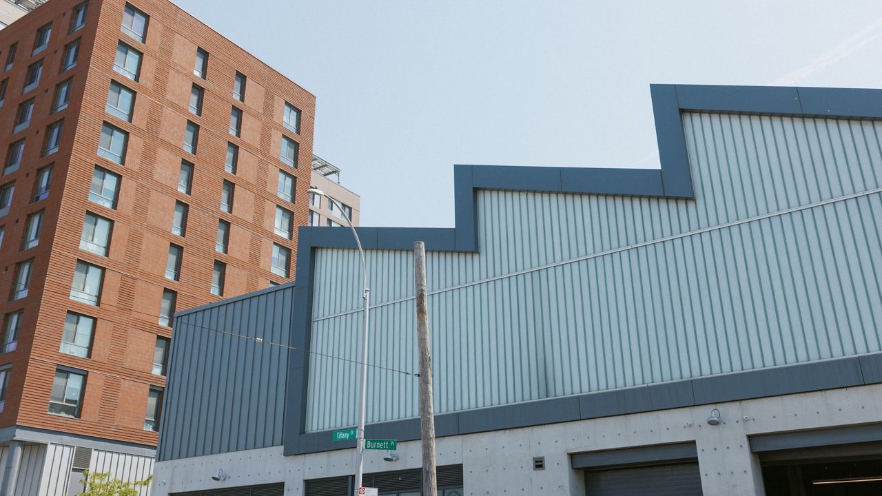 Officials tour planned site of first city-owned grocery store