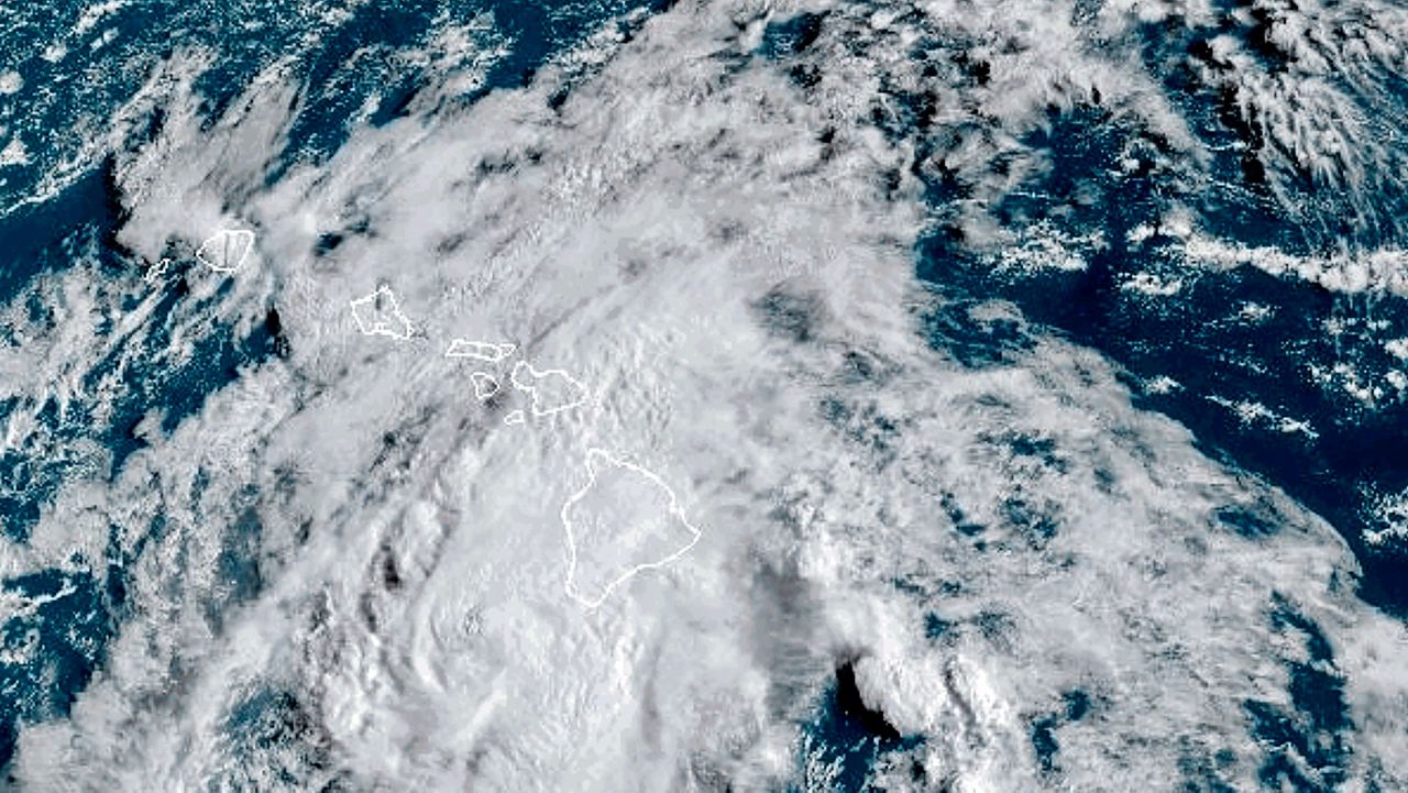 This Aug. 25, 2024 satellite image provided by the National Oceanic and Atmospheric Administration shows Hurricane Hone passing south of Hawaii. (NOAA via AP)