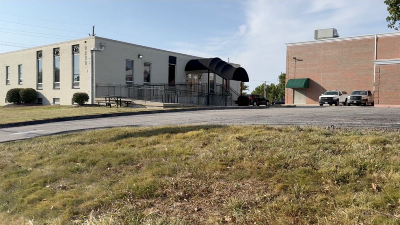 Police arrest a former Ritenour High School student outside Husky Academy Tuesday afternoon. (Spectrum News/John Gerding)