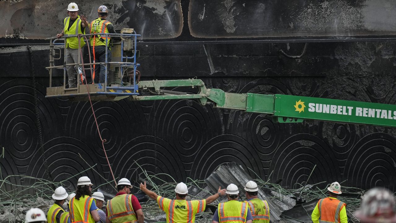 Crews work at the site of a collapsed elevated section of Interstate 95 in Philadelphia, June 14, 2023. (AP Photo/Matt Rourke, File)