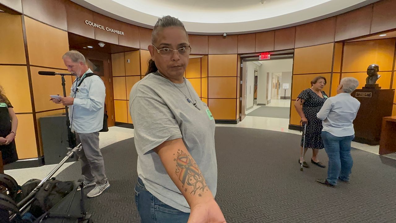 Maritza Gomez shows a tattoo that was done after surviving the Pulse nightclub massacre in June of 2016. (Spectrum News/Nick Allen)