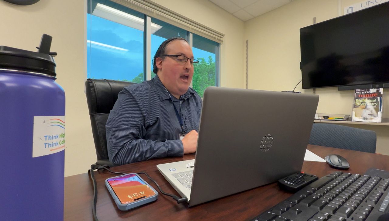 Chapel Hill Podcaster Kenneth Kelty records an episode. (Spectrum News 1/Marshall Keely)