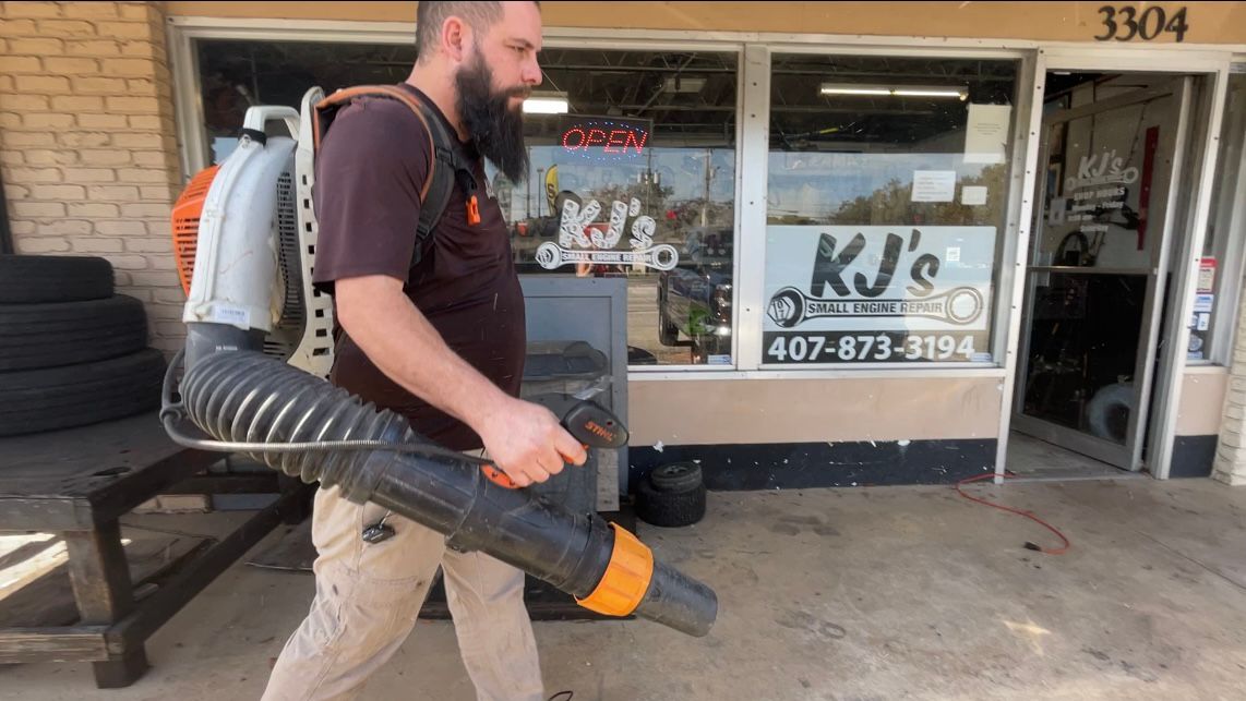 Brad Fournier repairs both gas and electric leaf blowers, and says gas leaf blowers are the best option for commercial lawn care. (Spectrum News/Celeste Springer)