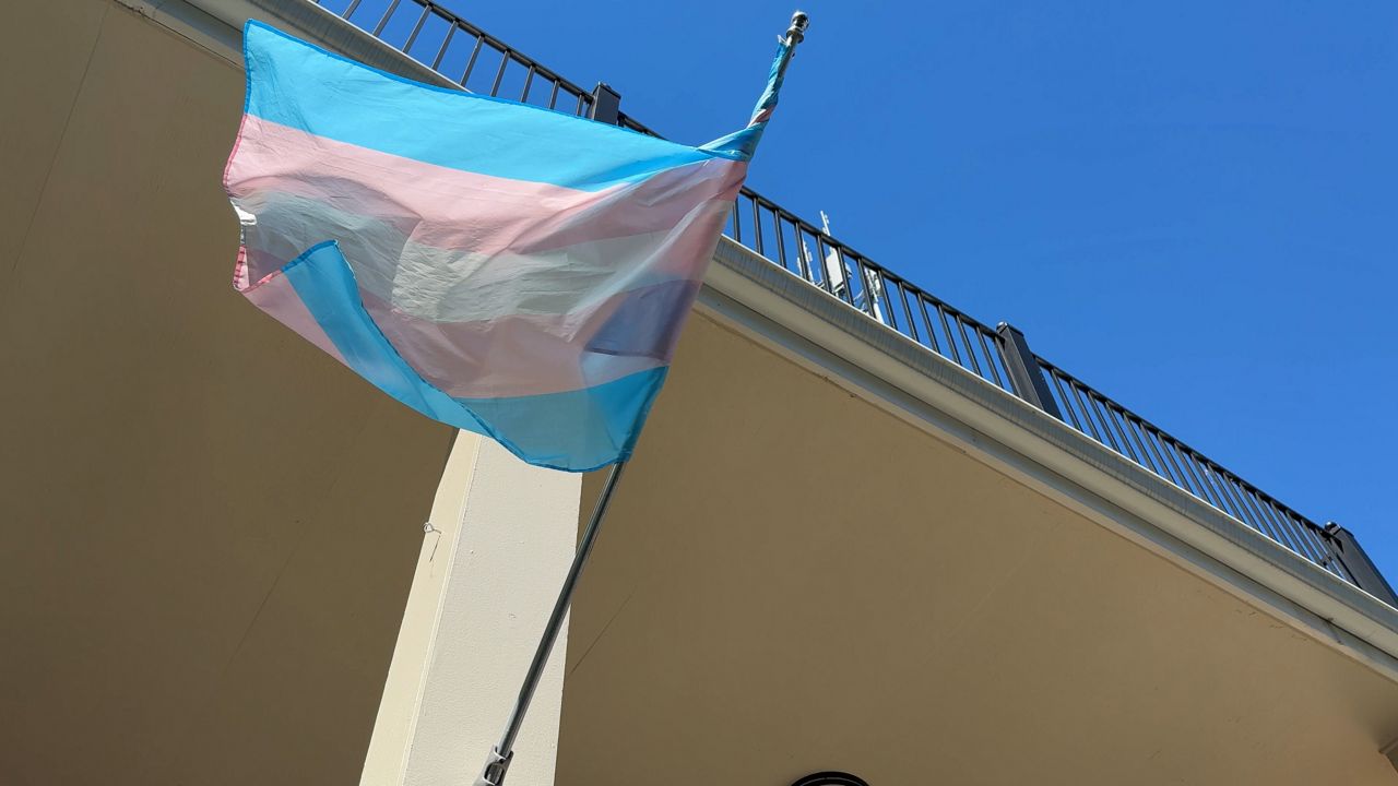 A trans flag flying outside Carrboro Town Hall is one of the banners that could be banned if legislation moving through the N.C. General Assembly becomes law. (Spectrum News 1)