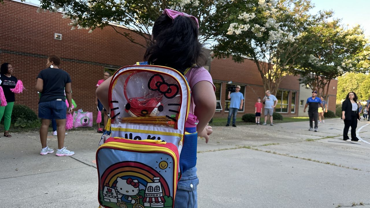A student heads to class Monday as year-round school resumes at Hope Valley Elementary in Durham. (Spectrum News 1/Sydney McCoy)