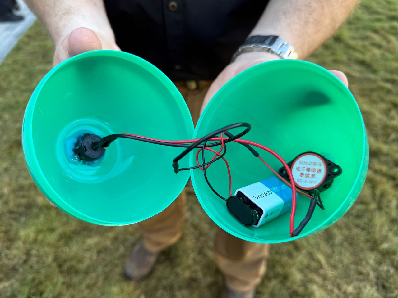 This is what the inside of the plastic eggs look like. OFD members added speakers, a battery, and wiring to make the eggs beep. (Spectrum News/ Emma Delamo)