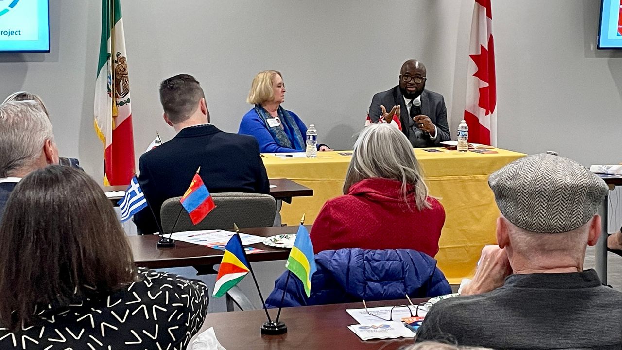 International Institute of St. Louis President and CEO Arrey Obenson, right, talks about how many Afghan and Ukrainian refugees the organization helped last year and is planning to welcome in 2023. 