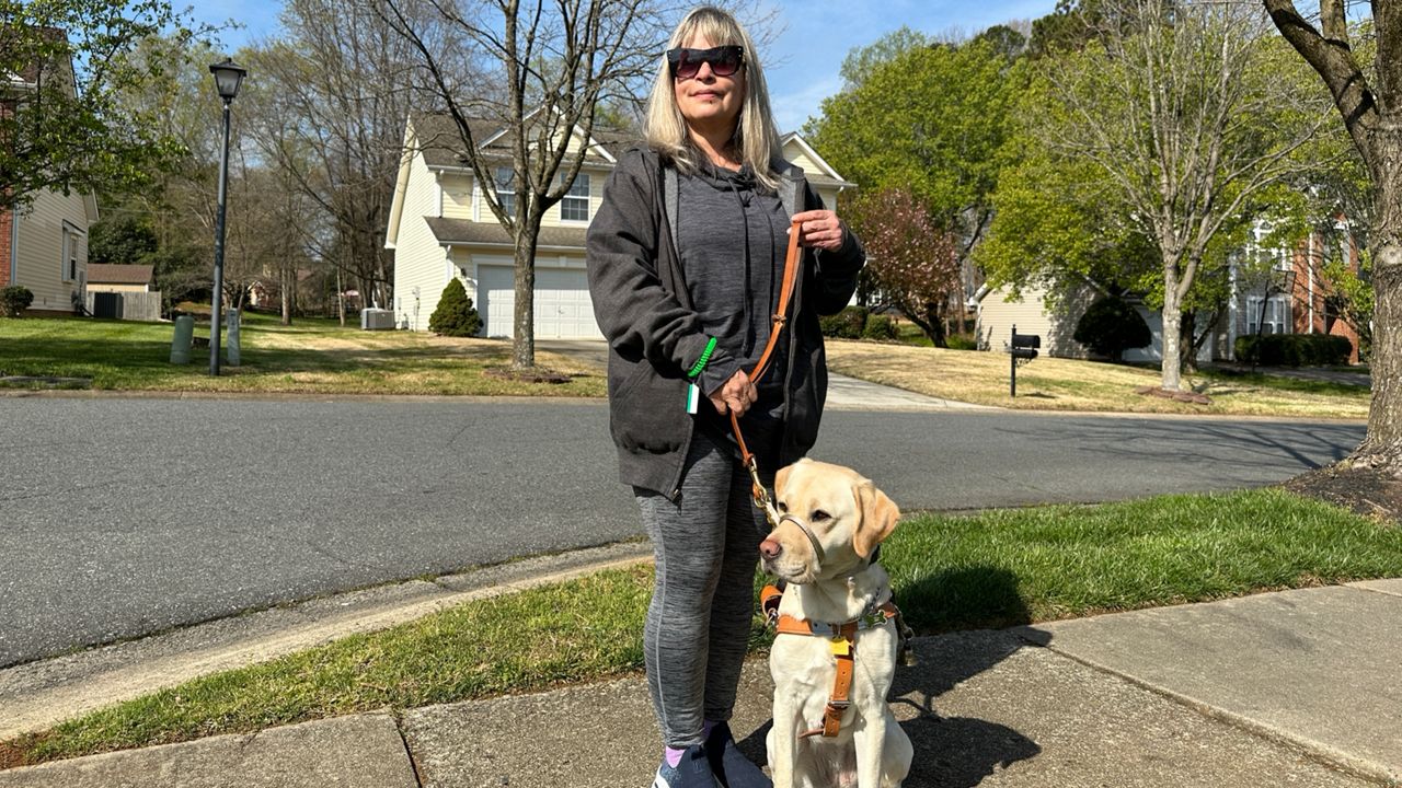 Luz Marina Rosenfeld and her guide dog