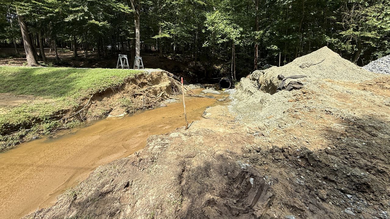 Four families are trapped in their homes in Burlington after their only road to the outside world caved in. (Spectrum News 1/Ashley Van Havere)