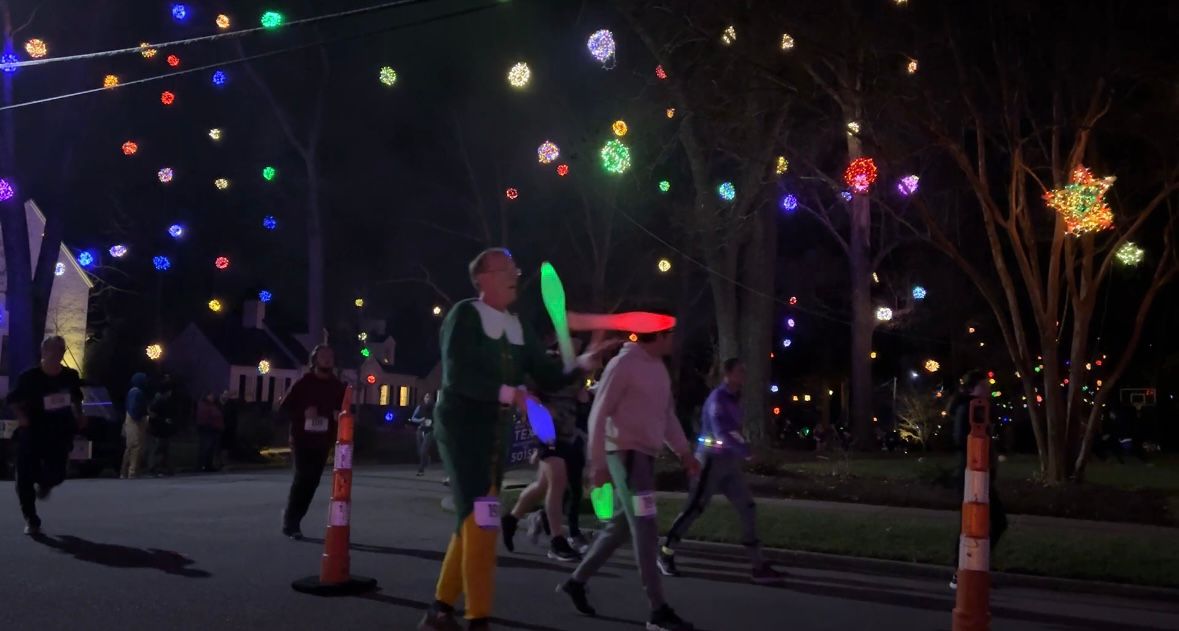 A runner juggling with completing the 2023 Running of the Balls on Dec. 16th.