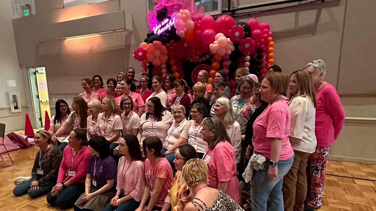 Volunteers Gather Before Doors Open at free Prom Shoppe. (Spectrum News 1)