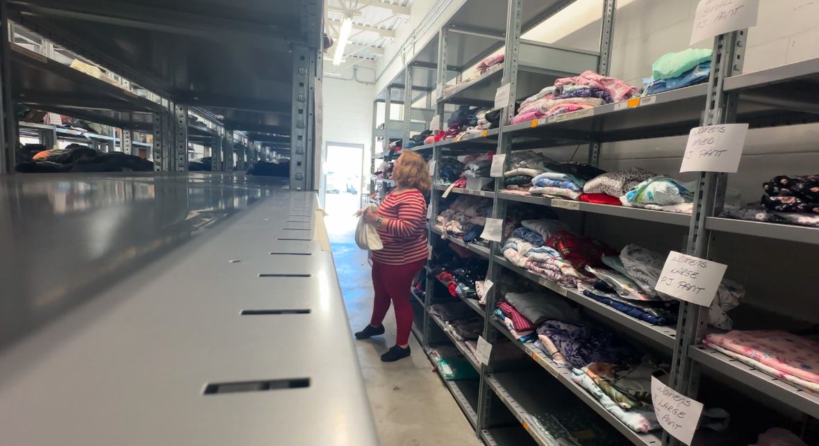 A volunteer with Silver Santas selects items to gift a senior in need. (Spectrum Bay News 9/Cait McVey)