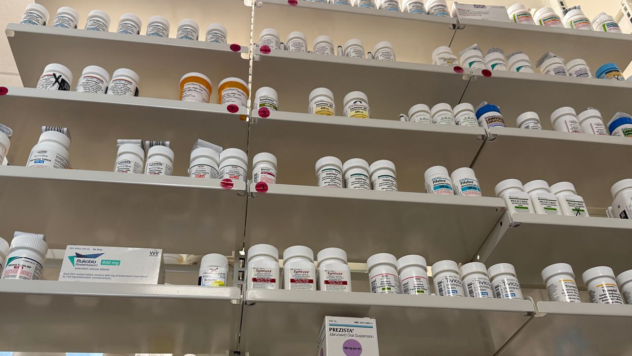 A pharmacy has its shelves stocked with HIV medication for patients.