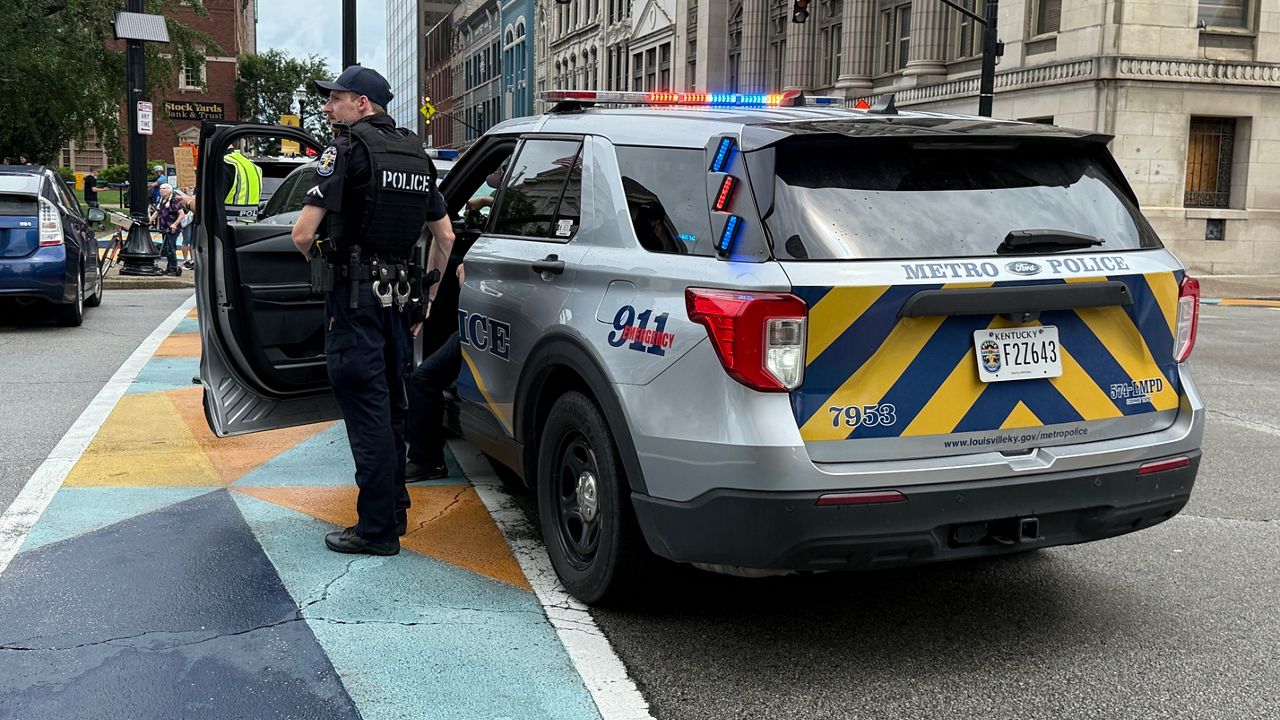 Louisville Metro Police Department remained onsite to block roads outside Metro City Hall in Louisville during the “No Kings” protest on Saturday, June 14. (Spectrum News 1/Destinee Flowers)