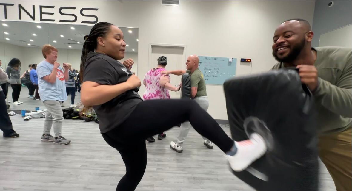 A woman practicing her self defense moves.