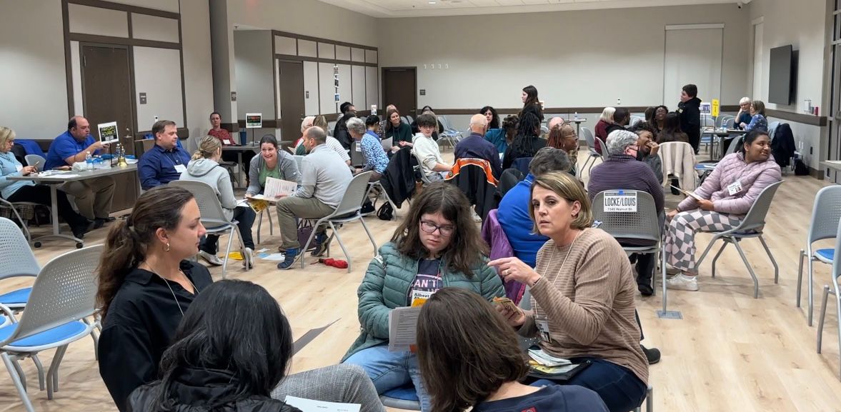 Community members participating in the poverty simulation.