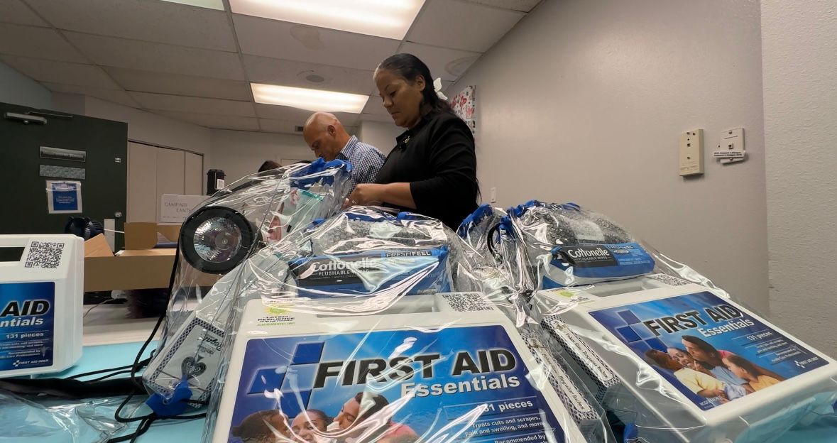 Valerie Velasquez helping put together hurricane kits for the Alianza Center. (Spectrum News/Lizbeth Gutierrez)