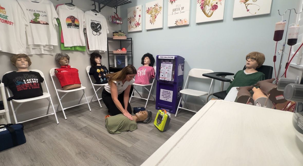 Lauren Ramirez, owner of Salus Medical Training, guides News 13 through a medical training exercise. (Spectrum News/Devin Martin)
