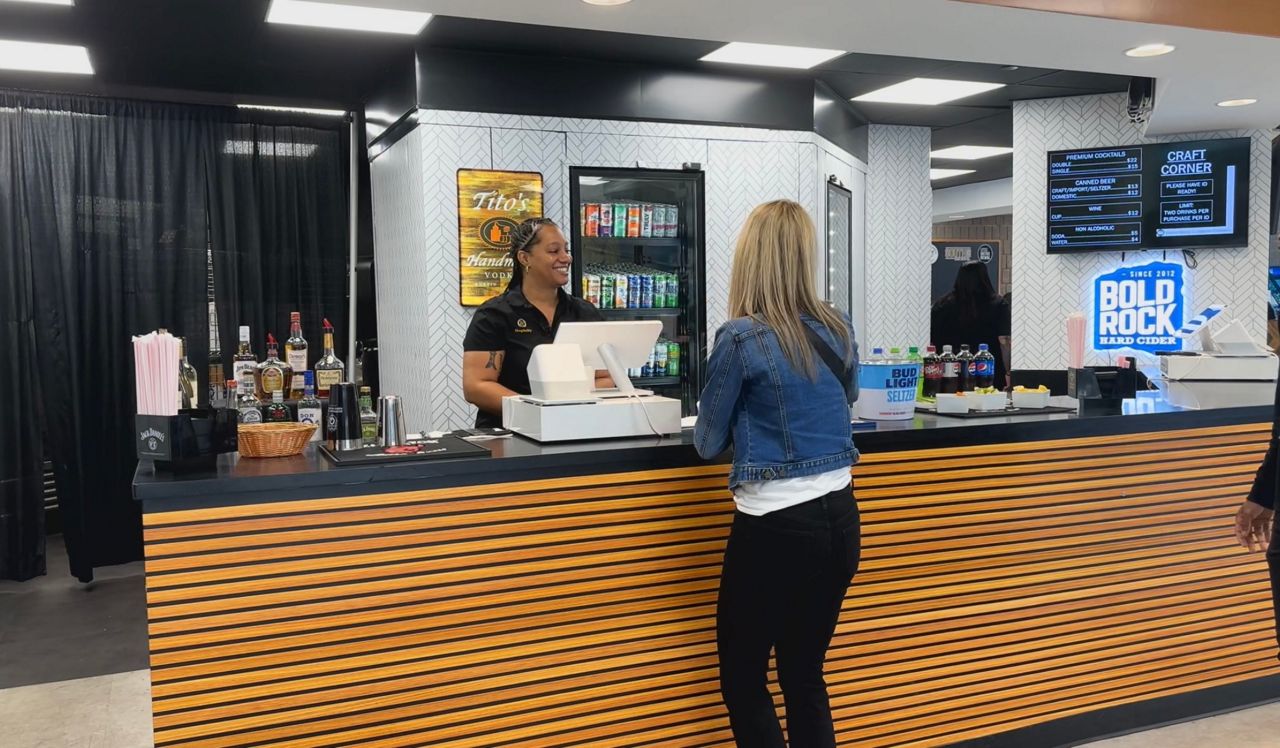 Brittney Lewis serving a patron at the Greensboro Coliseum.