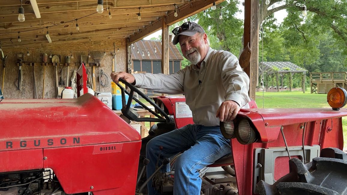 Some of John Narron's favorite things do on his property are ride trails and enjoy memories of his grandfather and father, like riding on this Massey Ferguson tractor. (Spectrum News 1/Rachel Boyd)