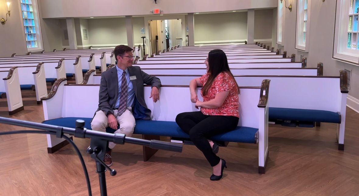 Dr. Chris Franks speaking with a former student at High Point University.