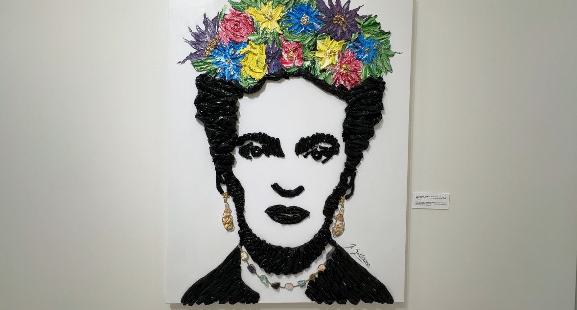 Julio Solórzano has a piece featured in the Hispanic Heritage Month art exhibit in downtown Orlando. This piece is called “Save the Planet.” It features Frida Kahlo, a Mexican painter known for her portraits. (Spectrum News/Devin Martin)